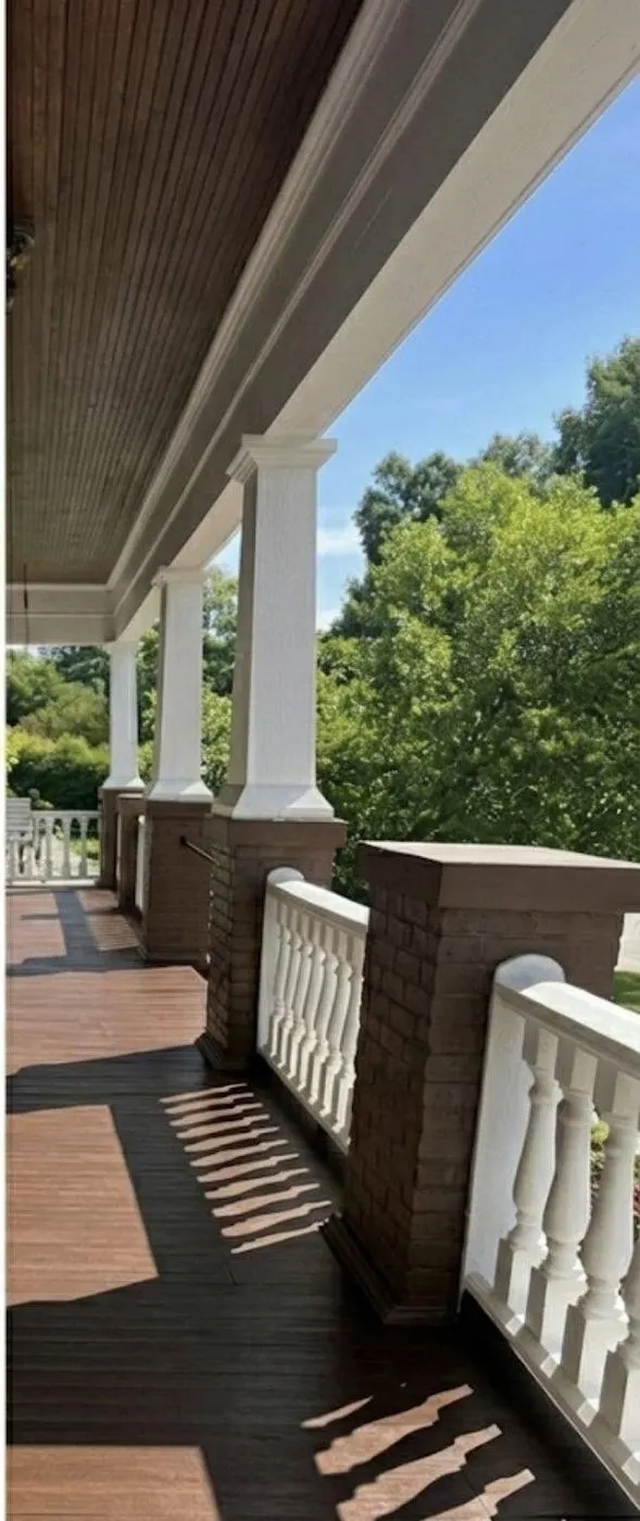After cleaning by East Alabama Surface Clean. Wood porch decking and railings, weathered then cleaned