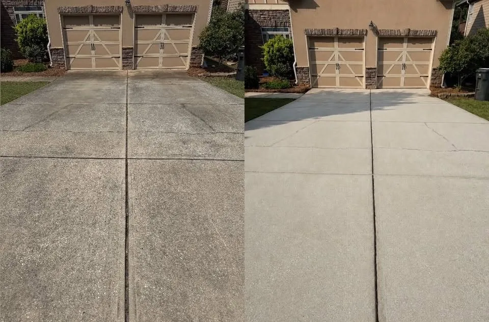 Driveway in front of two garage doors before and after cleaning
