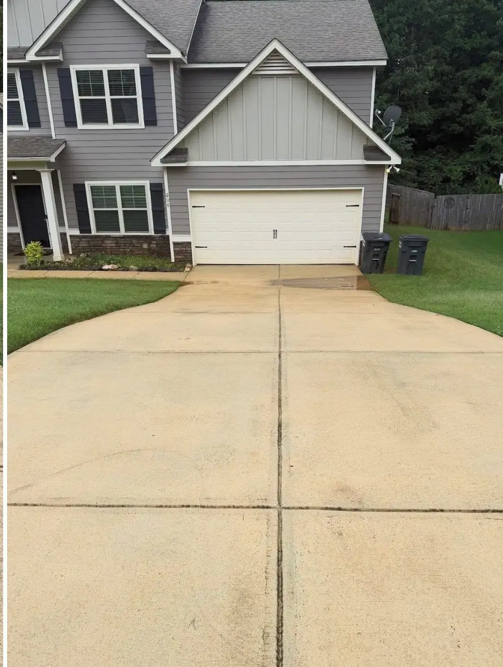 After cleaning by East Alabama Surface Clean. Driveway in front of a two-story home, dirty then cleaned