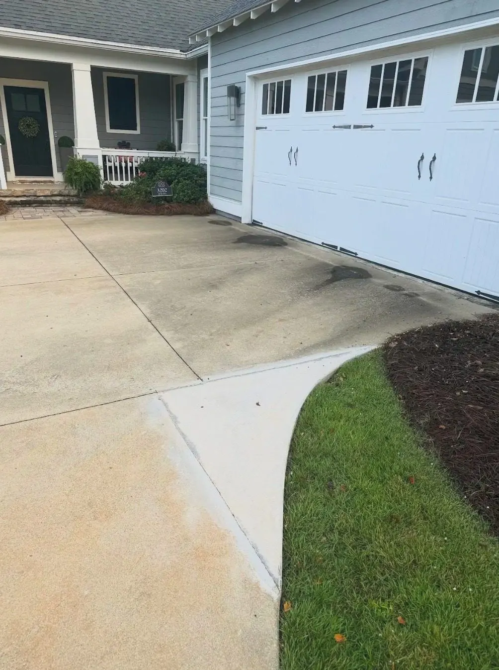 Before cleaning. Driveway and side walkway, dirty then cleaned