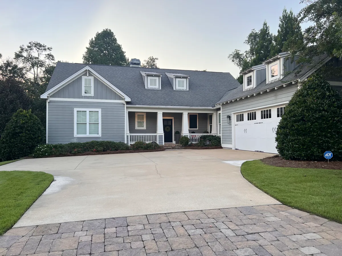 Finished residential driveway cleaning at a gray home