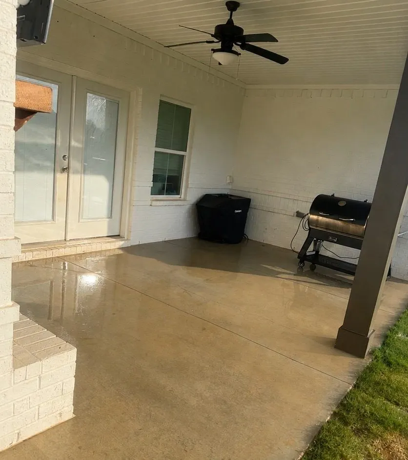 After cleaning by East Alabama Surface Clean. Covered back porch slab stained with red clay, then cleaned