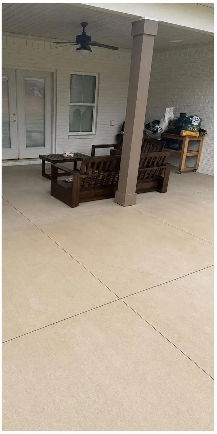 After cleaning by East Alabama Surface Clean. Covered porch concrete with rust and clay spotting, then cleaned