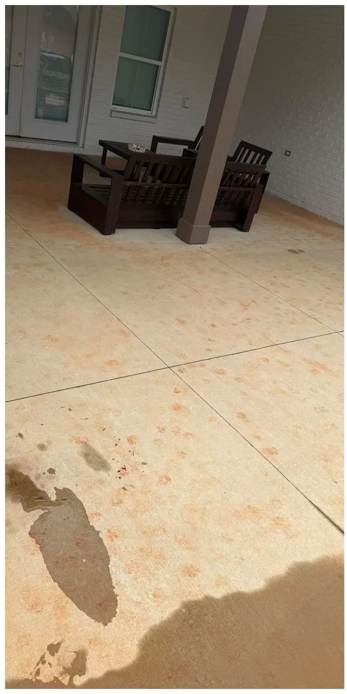 Before cleaning. Covered porch concrete with rust and clay spotting, then cleaned